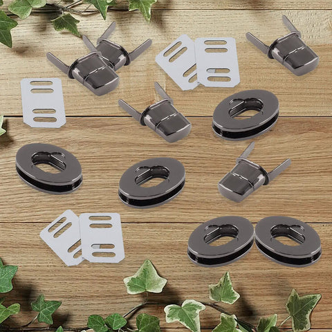 Top Shelf Black Twist Lock Clasps For Leather Bags And Diaries Heavy Duty Zinc Alloy Oval Turn Buttons set on wooden background.