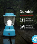 LED Camping Lantern With USB Charging, 800 Lumens Of Bright Light, Battery Powered And 200 Hour Run Time on wet wooden surface