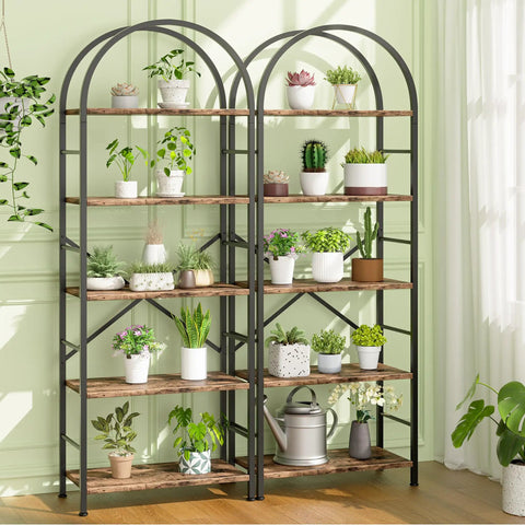 Arched Five Tier Bookshelf Tall Bookcase With Ample Storage For Books CDs And Office Essentials In Space Saving Modern Rustic Brown Finish, adorned with plants