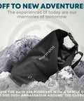 Black waterproof dry bag with zippered pocket and phone case, 20L for boating camping fishing beach kayak gear, on a mountain backdrop