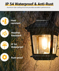 Easy Install Outdoor Solar Wall Lanterns Set Of 2 for Porch and Garden, waterproof LED sconce lit up with raindrops on glass panels.
