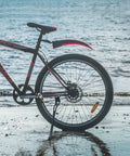 Adjustable 18mm Hole Spacing Bike Kickstand For 24, 26, And 27.5 Inch Mountain Bikes in use on beach trail