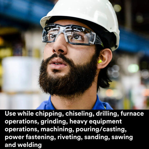 Worker wearing safety glasses and Premium Slow Recovery Foam Ear Plugs For All Day Comfort, 33 dB NRR, in a factory setting.