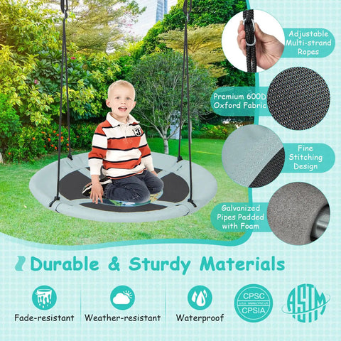 Child enjoying a 40 Inch Saucer Tree Swing For Kids With Carabiners, Adjustable Hanging Ropes From 55 To 71 Inches, Weatherproof 600D Oxford Cloth.