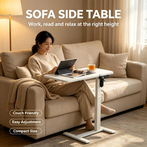 Stylish Electric Height Adjustable Mobile Overbed Side Table With Quiet Lifting Motor, Digital LED Display, Hidden Rolling Wheels, And Sleek Design For Ultimate Comfort And Versatile Usage In Any Bedroom Or Home Office Setup Today, next to a woman on a couch.
