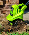 20V Cordless Garden Tiller Cultivator With 7.5 Inch Tilling Head, 2Ah Battery And Fast Charger Included, Green in action on soil