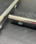 Close-up view of 12 Pack Welding Table Fixture Pins Five Eighths By One By One Point Five Inches Aluminum Quick Setup Fixturing Kit on table.