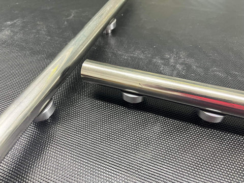 Close-up view of 12 Pack Welding Table Fixture Pins Five Eighths By One By One Point Five Inches Aluminum Quick Setup Fixturing Kit on table.