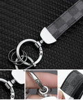 Two Pack Premium Leather Keychain Set for Cars and Everyday Carry on woven surface, metal rings, close-up details.