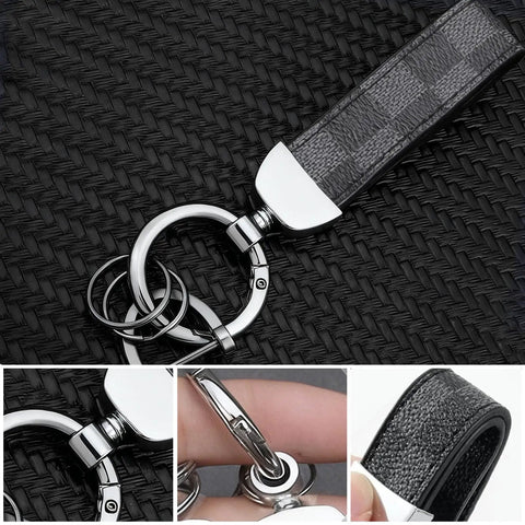 Two Pack Premium Leather Keychain Set for Cars and Everyday Carry on woven surface, metal rings, close-up details.