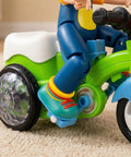 360 Degree Electric Stunt Tricycle Toy With LED Lights And Music, Omnidirectional Wheels For Kids, Push Pull Ride On Trike, Random Color, Battery Not Included, Perfect For Boys And Girls Classroom Playtime close-up side view