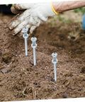 Heavy Duty Lawn Aerator Shoes With 10 Metal Spikes for grass replacement in use, showing metal spikes in soil for lawn care and maintenance