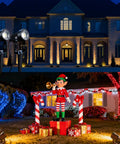 No Fuss All In One Low Voltage Landscape Lighting Kit With Dusk To Dawn illuminating a large house and festive yard display at night