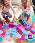 Two girls playing with Pink 178 Piece Flexible Track Toy Set with Bendable Race Tracks and Light Up Music, Princess Theme.