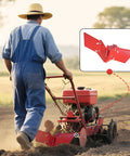 Farmer using a red rear tine tiller with Hiller Furrower Kit For Rear Tine Tiller With Adjustable Wing Fit For Land Reclamation attachment.