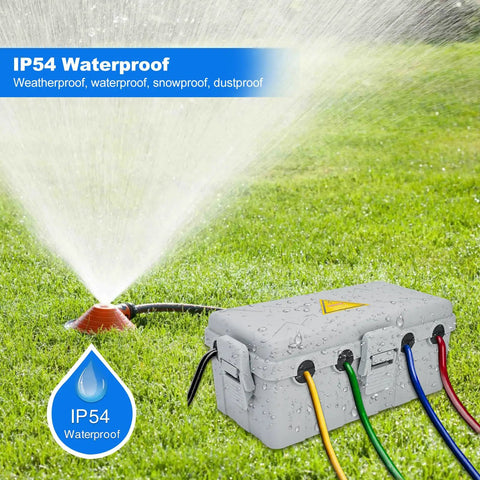 Heavy Duty Weatherproof Outdoor Electrical Box And Extension Cord Cover With Six Rugged Cable Ports next to a sprinkler on grass.