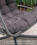 Close-up of charcoal grey seat cushion on Indoor Outdoor Egg Chair With Stand For Patio And Balcony Wicker Swing Egg Chair Rust Resistant Steel Frame And Heavy Duty Stand Adjustable Suspension Chain 350 Lb Capacity Charcoal Grey