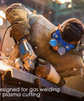 Worker using Flip Up Welding Safety Goggles Built For Gas Welding And Plasma Cutting With Shade Five Soft Blue PVC Adjustable Head Strap Four Vent System For Reduced Haze Easy Fit Eye Protection For Oxygen Acetylene Torches