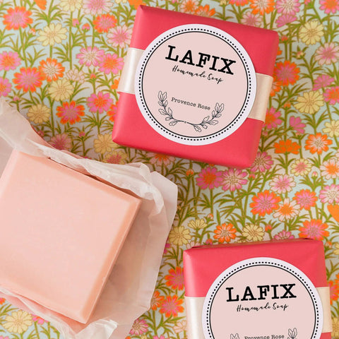 Slick Round Printable Labels 1 2/3 Inch Matte White 600 Count on LAFIX Homemade Soap packaging, decorative background.