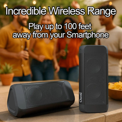 Angle 3 Ultra 2 Pack Portable Bluetooth Speakers on table with people in background, showcasing wireless range feature.