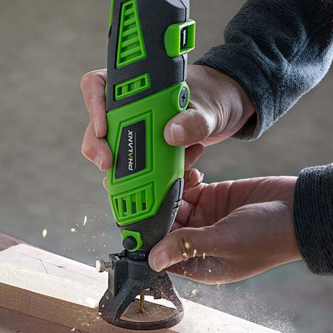PHALANX 180W rotary tool, green and black, side view with cutting wheel on wood.