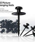 Sleek Double Headed Picture Hanging Nails For Drywall Renter Friendly Push Pins With Hand Protector Set Of 50 All Black Thumb Tacks in a clear container.