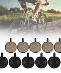Five Pairs Semi Metal Bicycle And Scooter Disc Brake Pads For Front And Rear Replacement On Electric Bikes And Scooters High Performance Braking For Wet Or Dry Conditions, displayed with a cyclist background