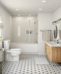 Modern bathroom featuring the Banbury Pivoting Toilet Paper Holder in Brushed Nickel beside a toilet, showcasing elegant decor.