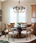Natural Boho 28 Inch Chandelier With Wooden Bead Tassels And Rust Iron Black Wagon Wheel Frame in dining room setting.
