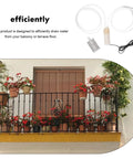 Hella Portable Submersible Sump Water Pump Features Dead Simple Usb Hookup Alongside Heavy Duty Stainless Steel Mesh Screen For No Sweat Balcony Drainage Jobs on a flower-filled balcony.