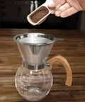 Next Level Pour Over Coffee Maker With Heat Resistant Borosilicate Glass Carafe And Comfortable Bamboo Handle Plus Durable Stainless Steel Filter for coffee brewing.