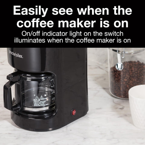 10-Cup Coffee Maker With Auto Pause And Serve on counter, visible carafe, and red on/off indicator light.