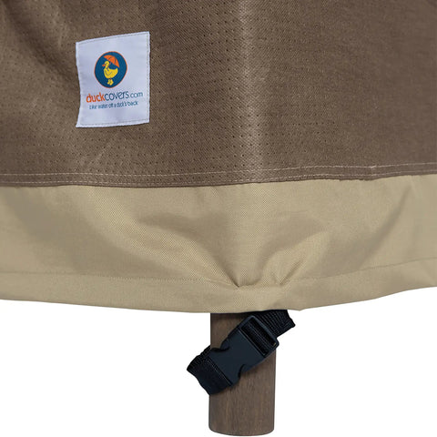 Lower view of Outdoor Waterproof 34 Inch Wide By 35 Inch Deep By 36 Inch High Patio Chair Cover with buckle on chair leg