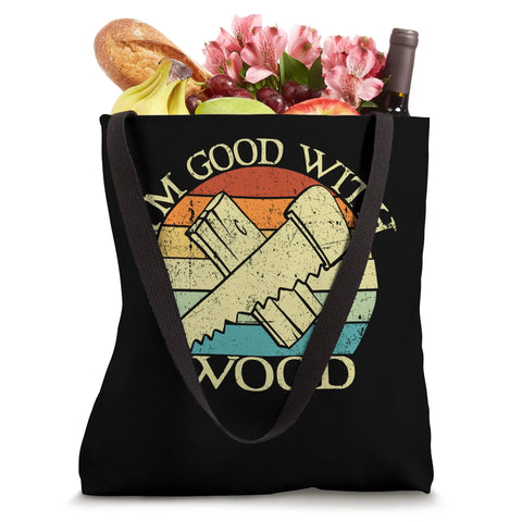 Totally Nailed It Dope Vintage Circular Saw Woodworking Tote Bag For Carpenters And DIY Craftsmen Plus Sweet Shop Essential Gift For True Makers Who Legit Appreciate Fine Timberwork And Quality Hand Tools, 16x16 inch black tote filled with fruits and flowers.