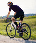 Cyclist on road bike equipped with Two Pack 26 Inch Beefed Up Heavy Duty Bike Inner Tubes With FV48mm Presta Valve Compatible tire sizes.