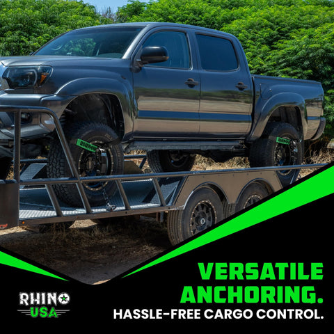 Heavy Duty 2 Inch By 8 Foot Car Tie Down Straps With J Hooks 4 Pack securing a truck on a trailer