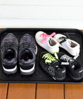 Two Pack Boot Tray Organizer For Shoes And Boots 20 By 15 Inches Heavy Duty Flex Plastic with kids' and adults' shoes placed on it