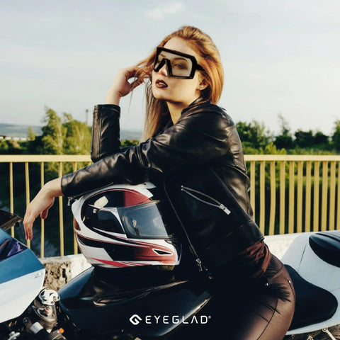 Badass Photochromic Safety Glasses with No Cap Impact Resistance for Cycling and Motorcycle Riding Featuring Rustproof Frames and Lightweight ANSI Z87 Approved Gear That Slaps for Worksite or Outdoor Adventures worn by a model in a leather jacket.