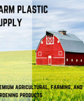 Red barn in a green field under cloudy sky, showcasing premium farming products supply