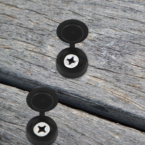 Hinged Plastic Screw Cover Caps With Shutter Fold Design on wood surface, showing black snap-on tops concealing screws for furniture.