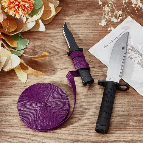Purple Ito Sageo Wrapping Cord 5m Silk Cotton Blend 0.51 Inch Wide for Katana handle wrapping next to two knives on wooden surface