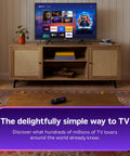 Sleek 32 Inch Full H d Smart Television Packing Hella Crisp Picture Quality And Dead Smooth Streaming Tailored For Chill Bedrooms And Bustling Kitchens on a wooden TV stand with decor.