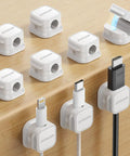9 Pack Magnetic Cable Clips For Easy Cable Management Under Desk And On Walls, white clips holding various cables on wooden surface.