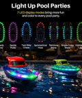 Two Pack RC Boats For Kids Ready To Race With 7 Mode LED Lights Water Spray Dual Batteries Two Point Four GHz Remote Range 164 Feet Remote Control Pool Boats Gift For Boys And Girls displaying LED modes at night in a pool