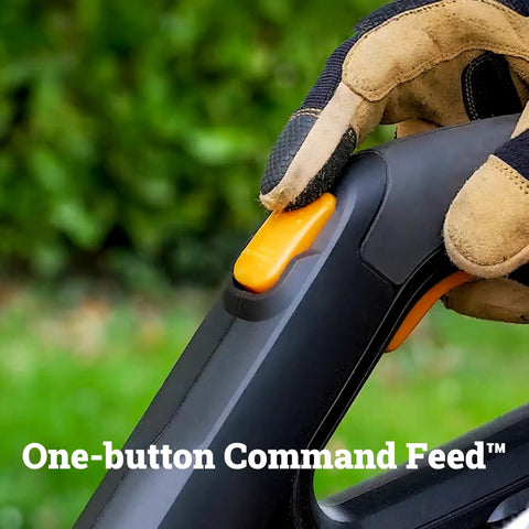 Gloved hand pressing button on Cordless String Trimmer and Lawn Edger for 12 Inch Cutting Path, 20V Weed Eater with Instant Line Feed.