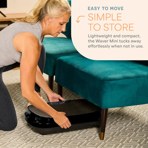 Woman storing Waver Mini Vibration Plate For Full Body Toning And Lymphatic Drainage under sofa
