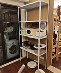 Hella Sturdy DIY Modular Shelving Track, Rust Proof Slotted Steel Angle Strips on a tall shelf in a home setting.