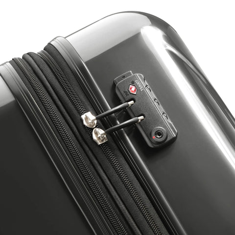 Close-up of Delsey Paris Helium Aero hardside luggage in brushed charcoal with TSA lock and double zipper.