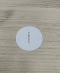 Label for heavy duty furniture moving sliders on a wooden surface, showcasing round glide pad design for easy couch moving.
