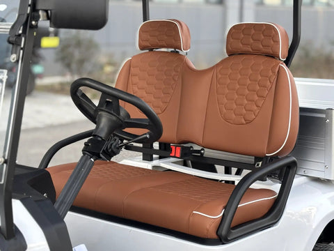 Pull Up In Style With This Badass Two Seater Golf Cart Featuring A Rock Solid Aluminum Cargo Bed 48V Lithium Battery Epic 4Kw Motor Sweet Directional Handling And Vibrant Yellow Paint For Total Neighborhood Dominance with tan cushioned seats and steering wheel